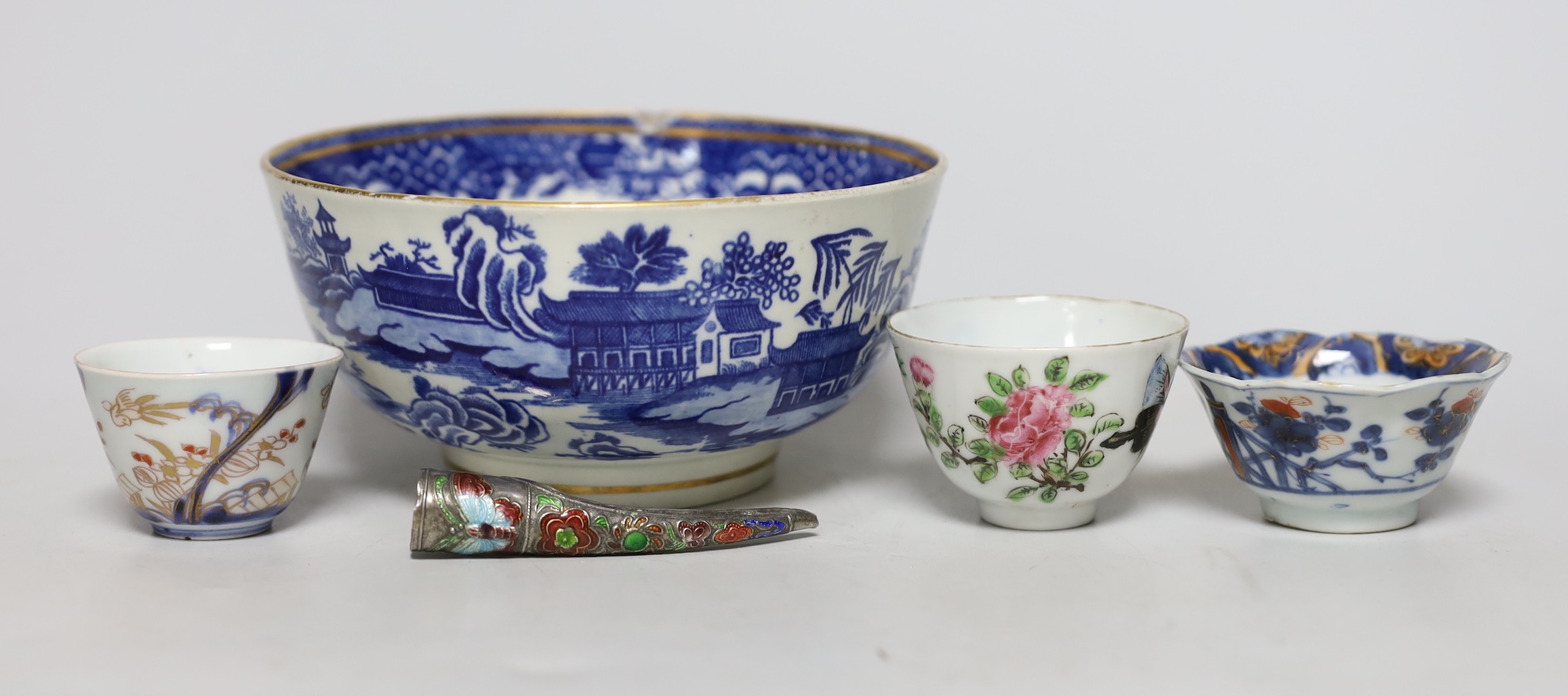 An English porcelain blue and white slop bowl, 15cm diameter, together with three miniature Chinese tea bowls and one nail guard